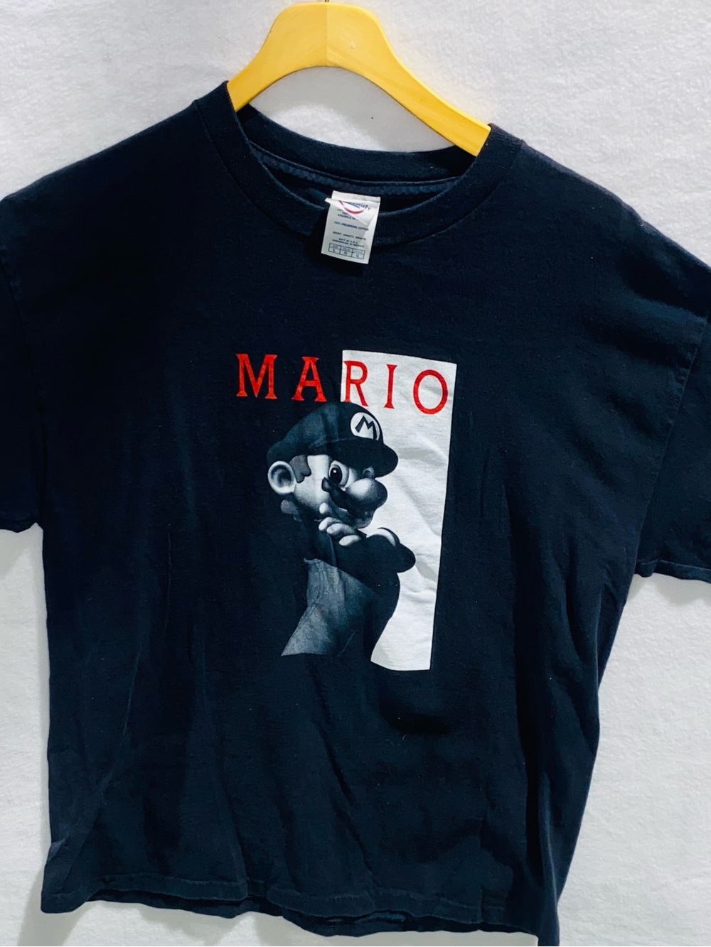 Delta Black Mario Graphic Tee with Red Lettering